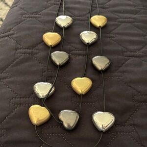 Multi toned multi-strand puffy heart choker necklace from the brand Drool.